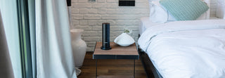 Miamo Aroma Midi diffuser on a table in a hotel room, providing a soothing fragrance experience